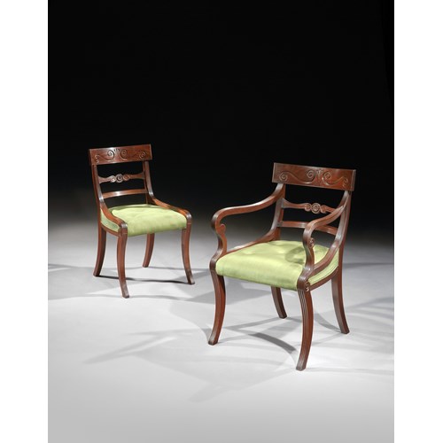 A set of eighteen dining chairs